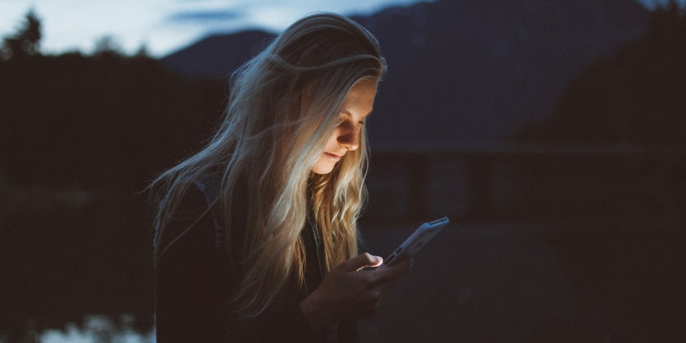 A woman searching for a Random Website Finder to cure doomscrolling